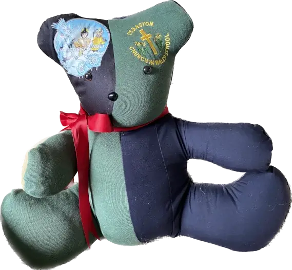 Teddy bear made from Osbaston schools uniform given to Carbonne Primary School